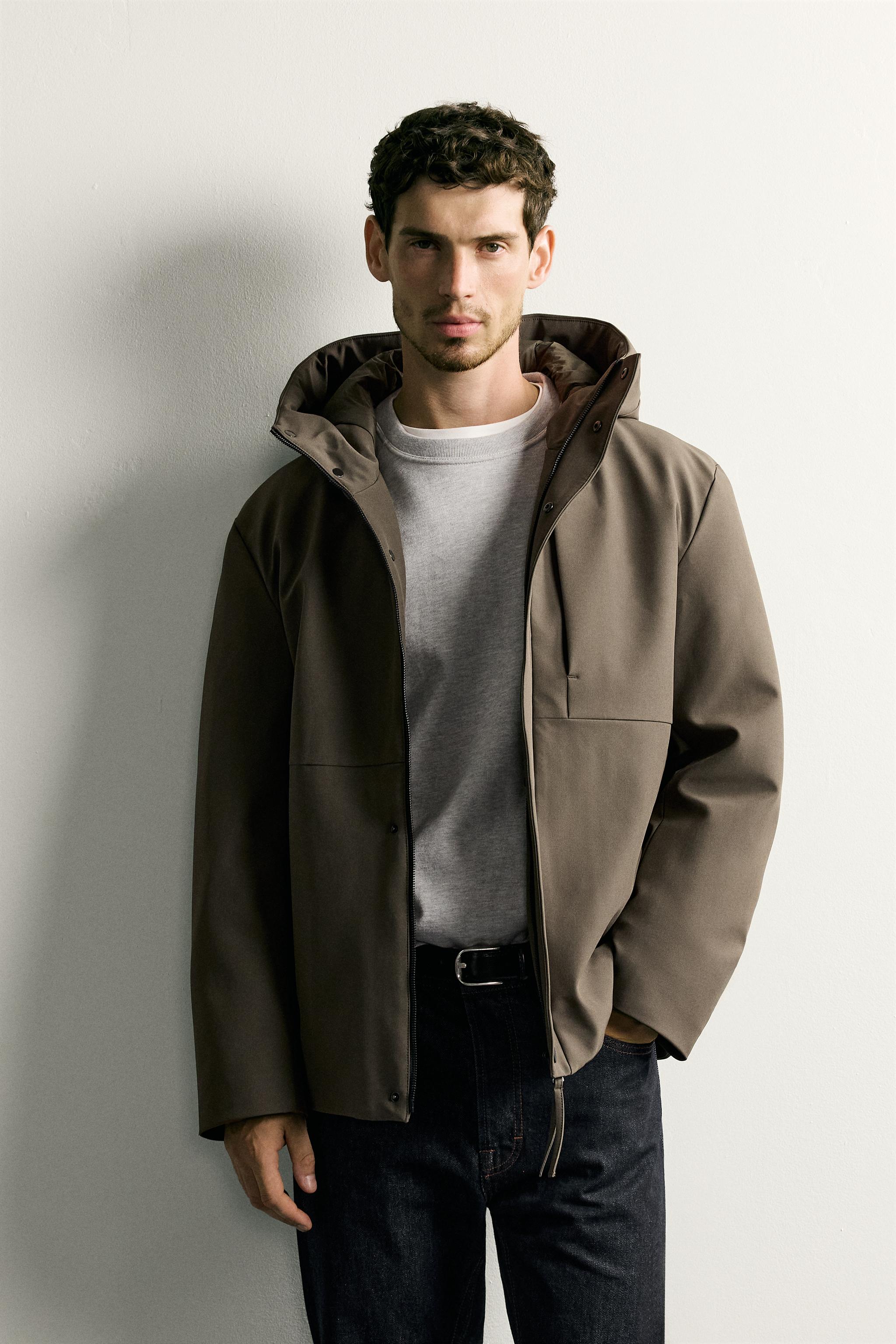 BLOUSON TECHNIQUE À CAPUCHE DÉPERLANT